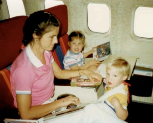 My mom, brother, and I reading on the plane